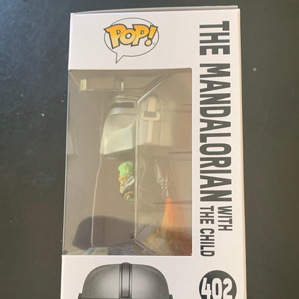 FUNKO POP THE MANDALORIAN WITH THE CHILD #402 STAR WARS - PopFictionParlor